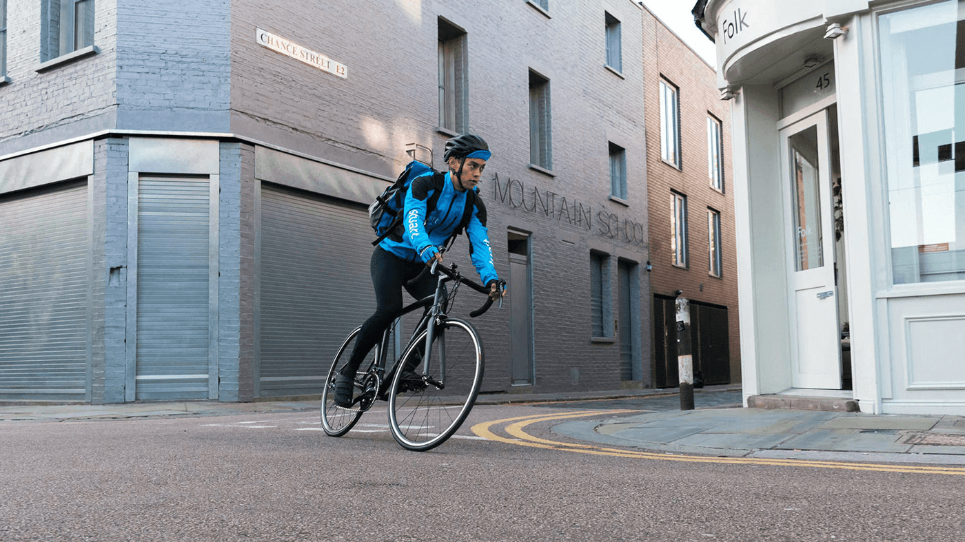 Courier messenger on the bike in stuart hoodie